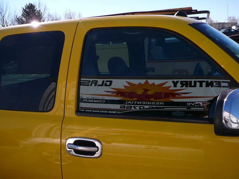 A yellow truck with the door open.